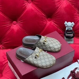 Gucci Women's Beige Monogram Mules